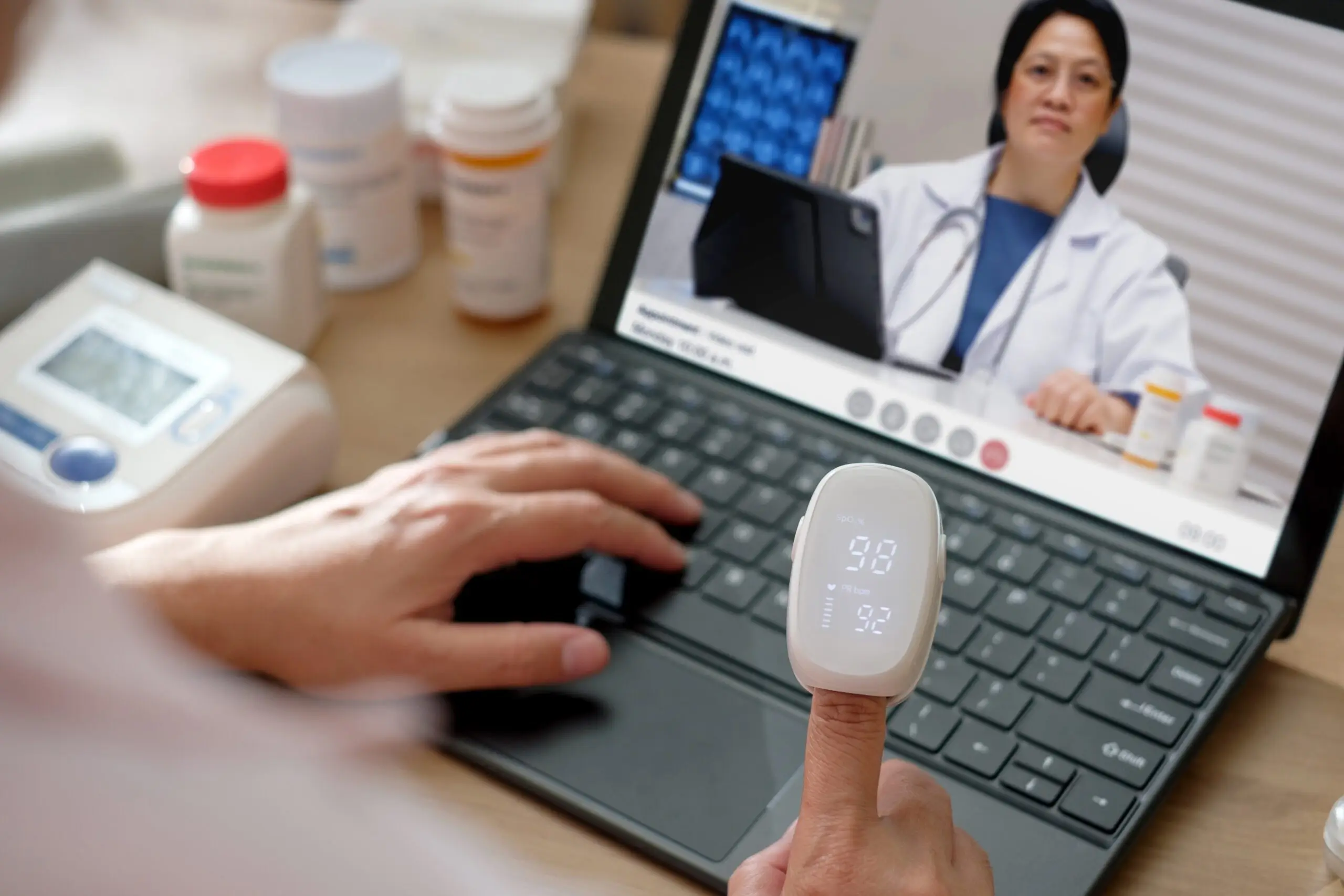 Asian Woman Using Telemedicine for Doctor Visit at Home